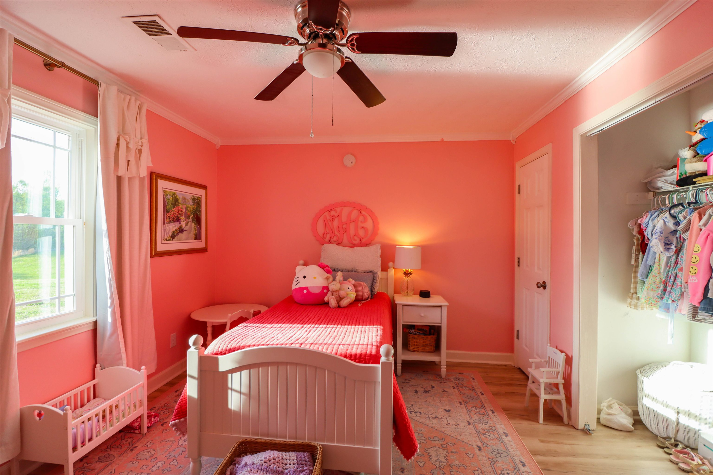 495 Junius Lee Road Ripley, TN 38063 - Photo 31 of 38 a bedroom with a bed and a chandelier