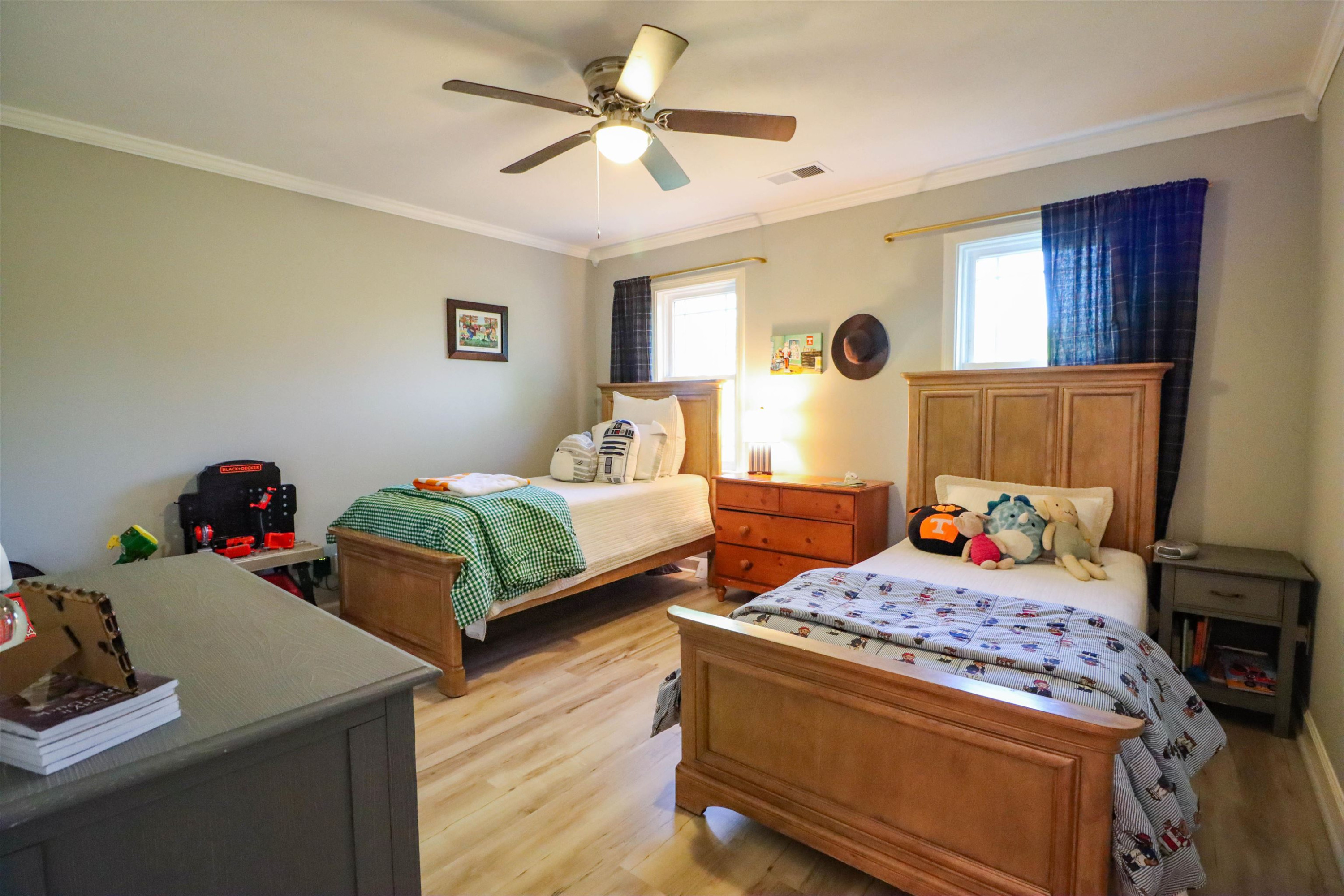 495 Junius Lee Road Ripley, TN 38063 - Photo 32 of 38 a bedroom with two beds and a chandelier