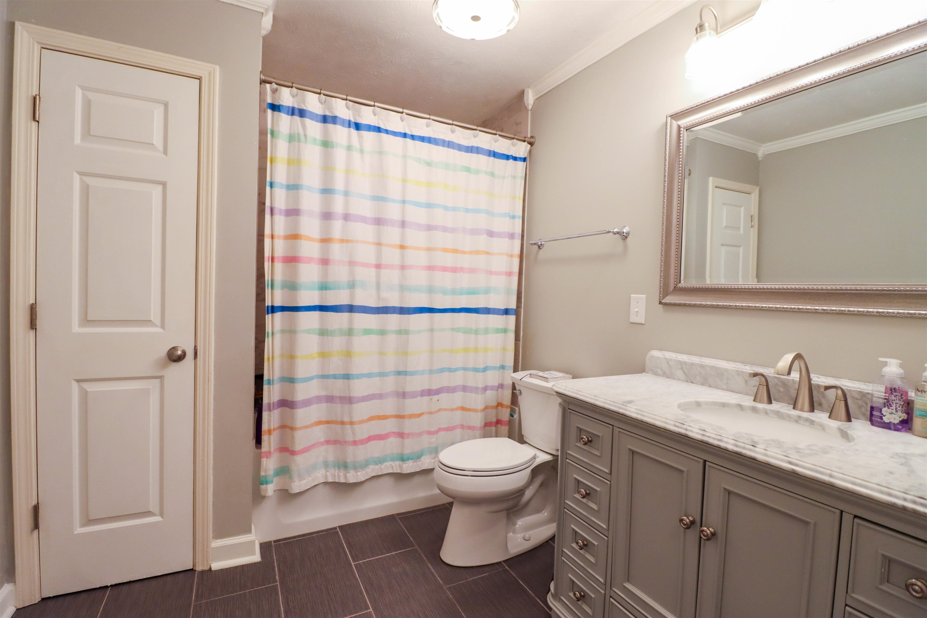 495 Junius Lee Road Ripley, TN 38063 - Photo 34 of 38 a bathroom with a sink a toilet and shower