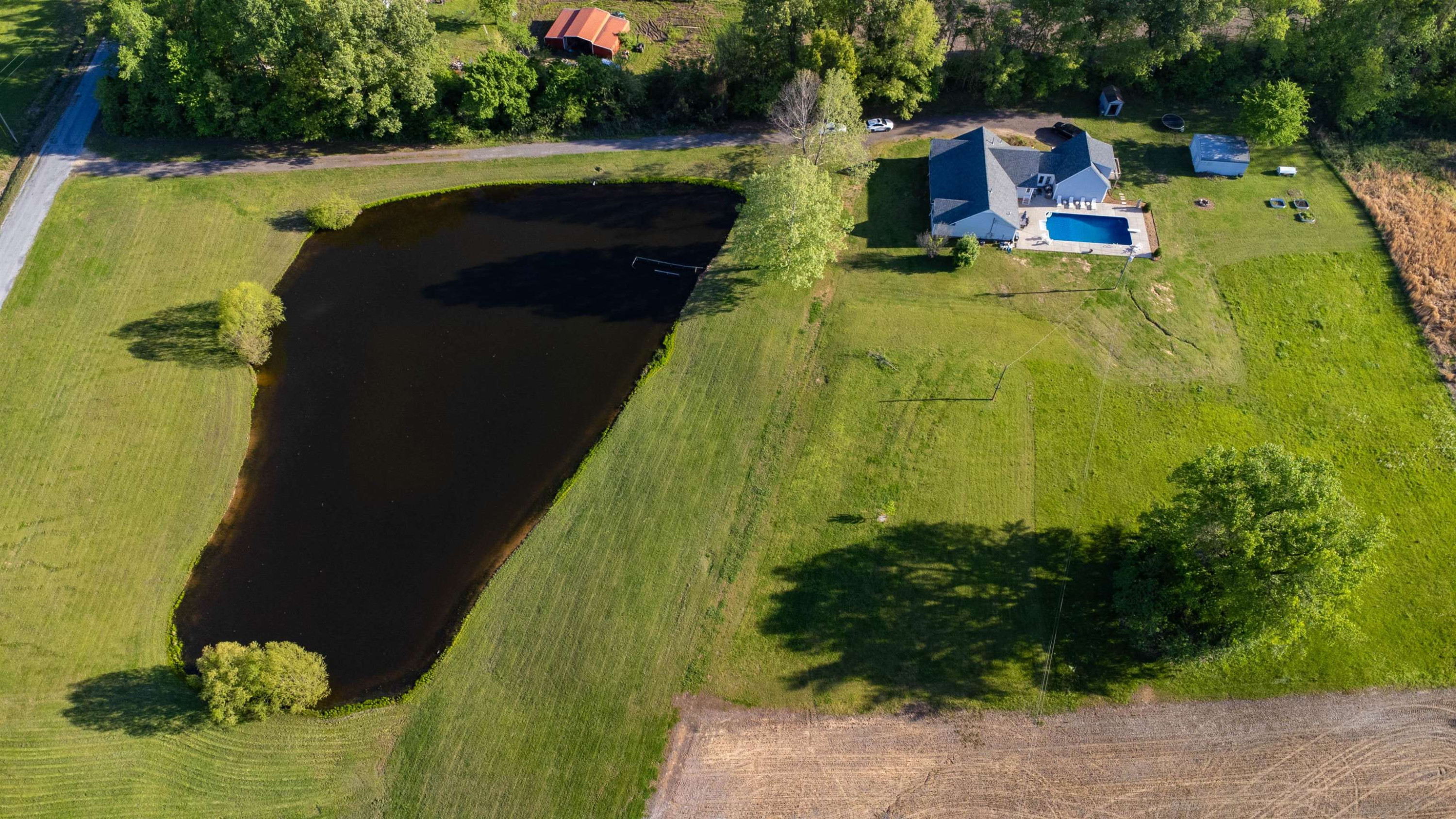 495 Junius Lee Road Ripley, TN 38063 - Photo 10 of 38 a view of a swimming pool with a yard
