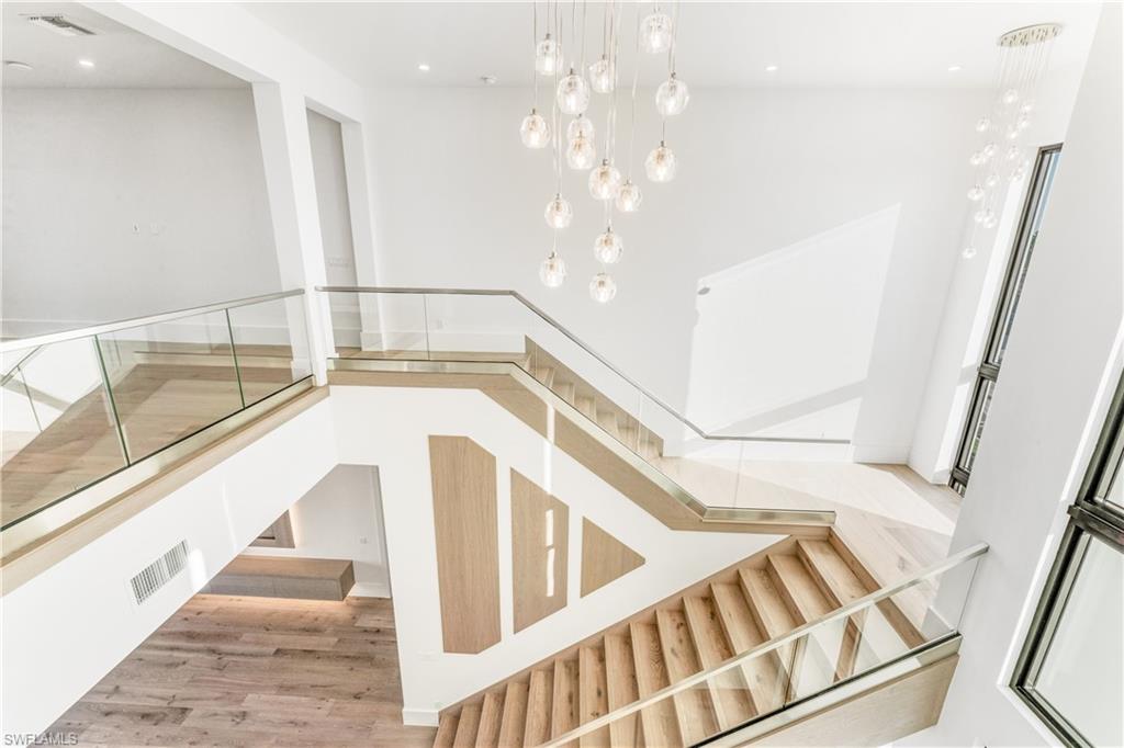 159 Dan River Court Marco Island, FL 34145 - Photo 18 of 38 Stairs with wood finished floors and recessed lighting