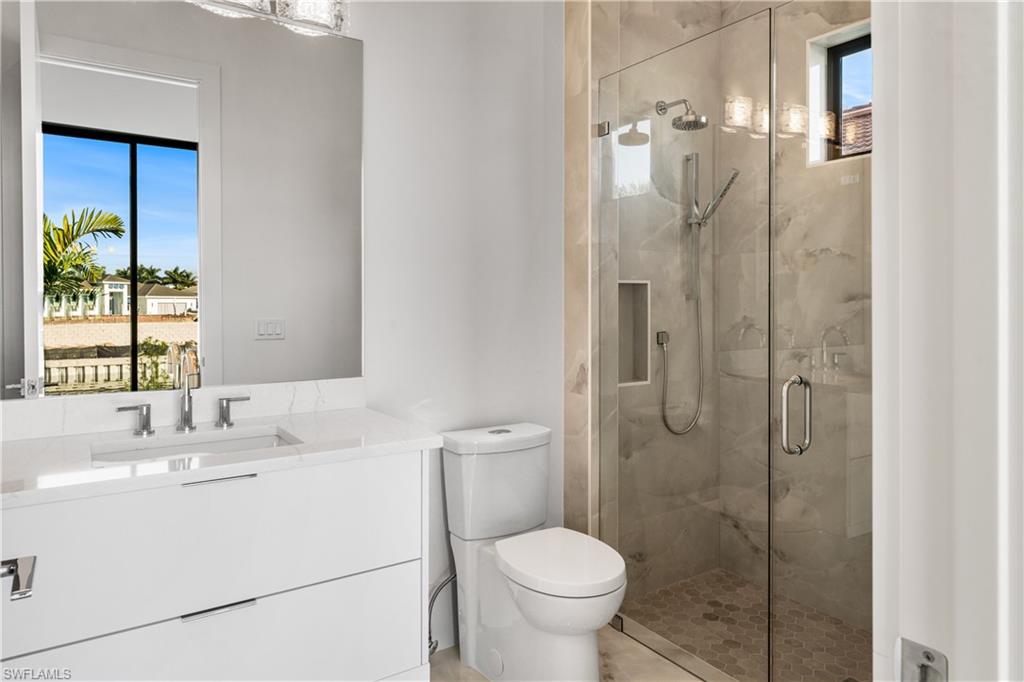 159 Dan River Court Marco Island, FL 34145 - Photo 30 of 38 Full bath with vanity and a marble finish shower