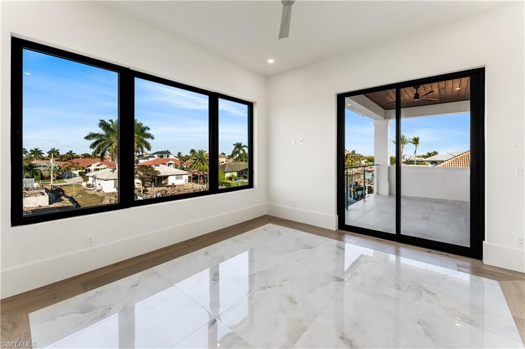 159 Dan River Court Marco Island, FL 34145 - Photo 35 of 38 Spare room with recessed lighting, light marble finish flooring, and ceiling fan