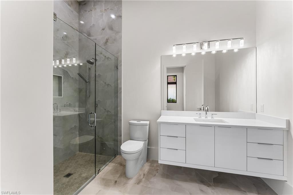 159 Dan River Court Marco Island, FL 34145 - Photo 37 of 38 Full bath featuring vanity and a marble finish shower