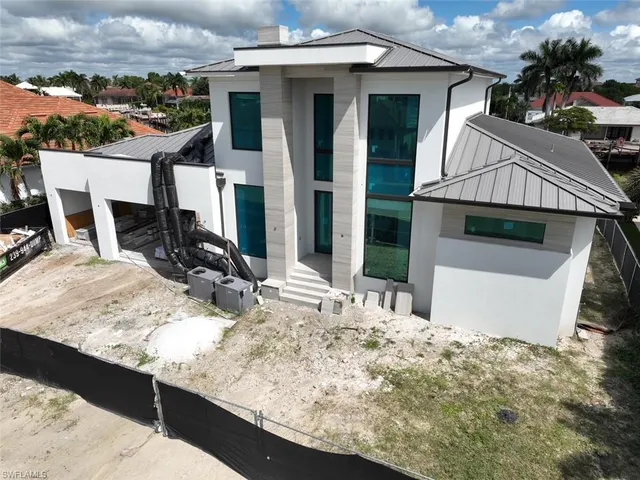 a view of a house with roof deck front of house