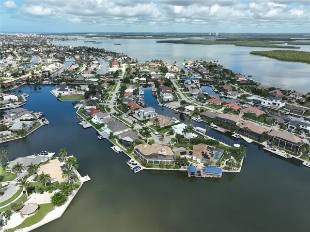 an aerial view of a house with a lake view