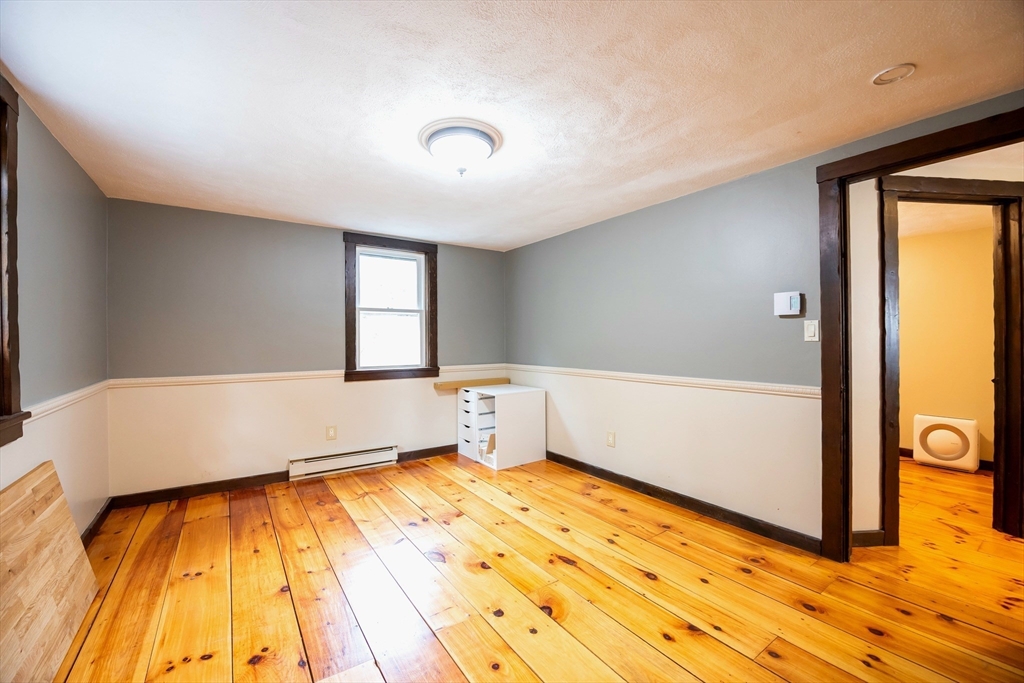 43 Williams Street Rehoboth, MA 02769 - Photo 13 of 17 a view of an empty room with wooden floor and a window
