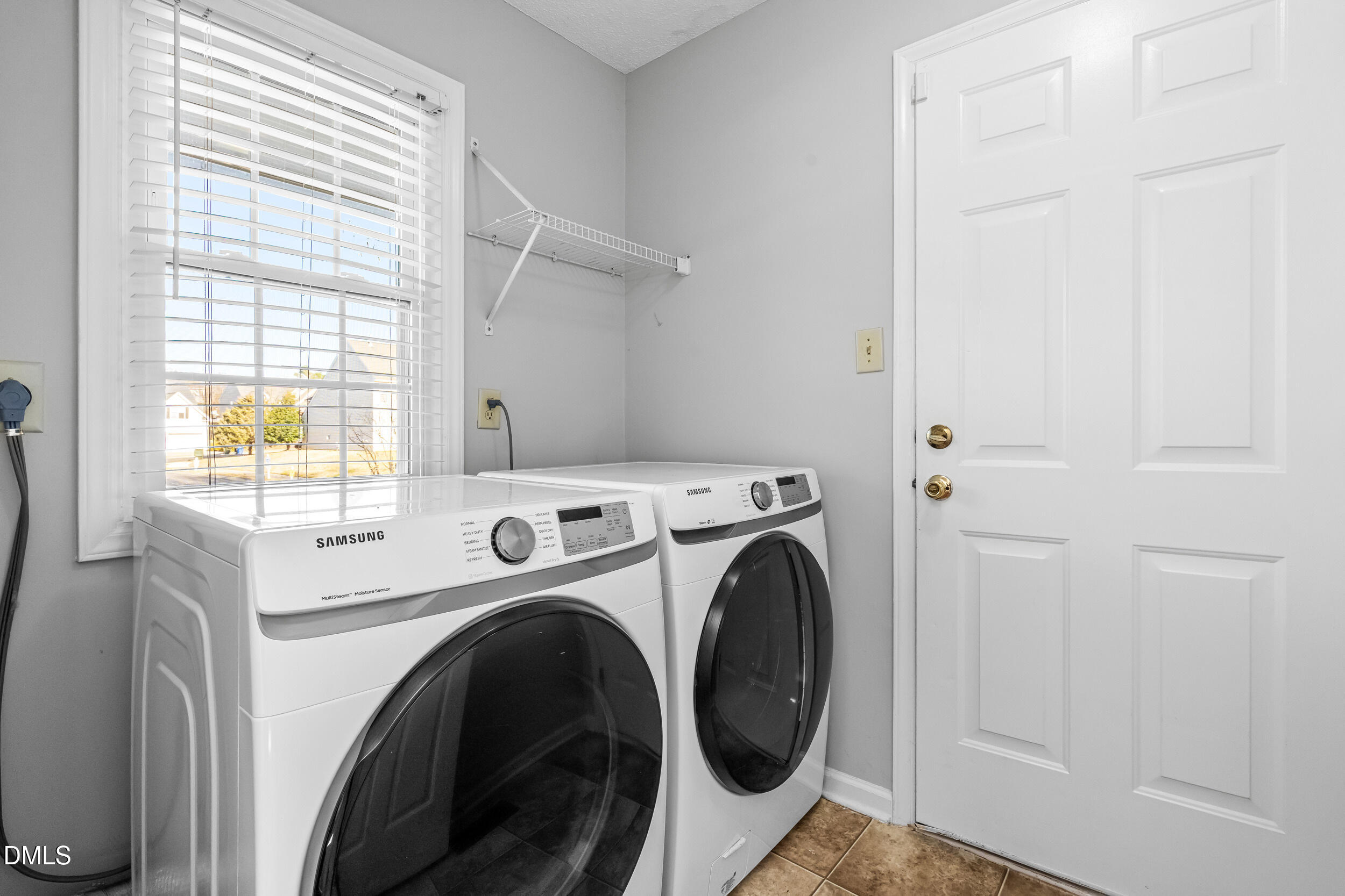 5228 Turf Grass Court Raleigh, NC 27610 - Photo 18 of 34 a view of washer and dryer in a utility room
