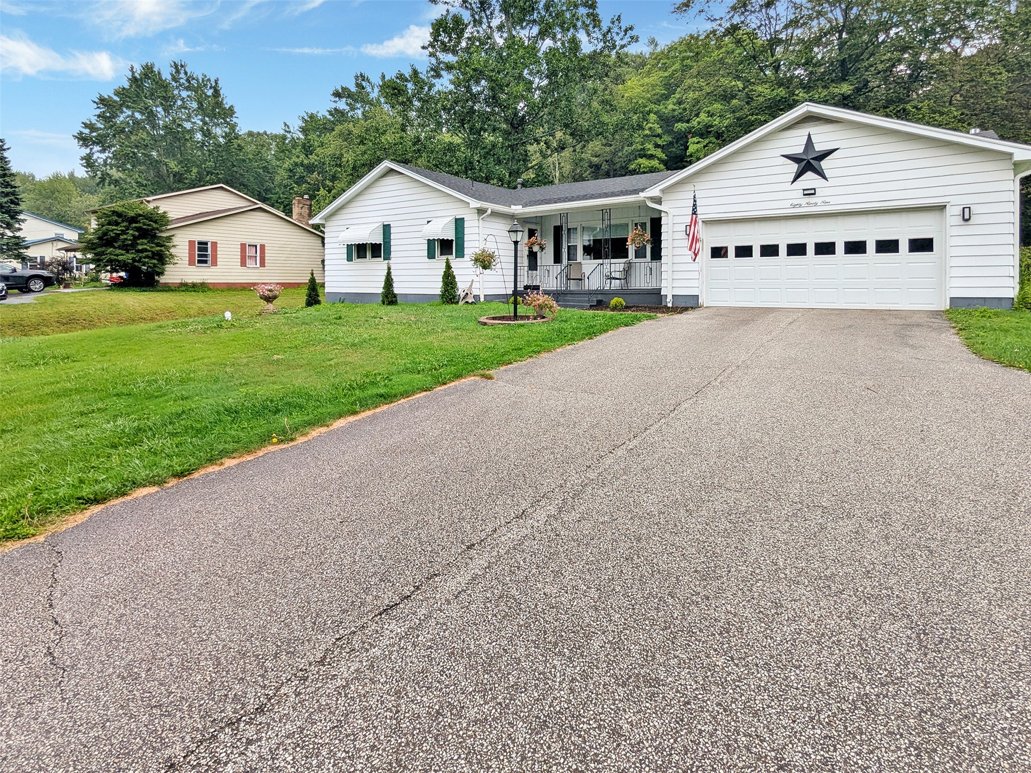 This great ranch features a large driveway with lots of parking options.