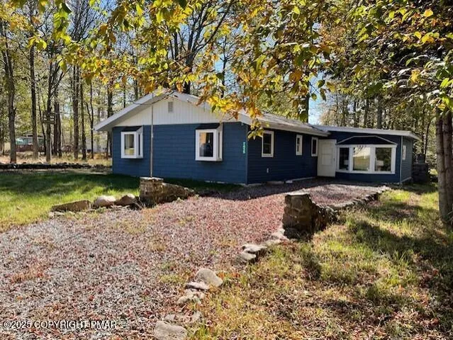 a house view with a garden space