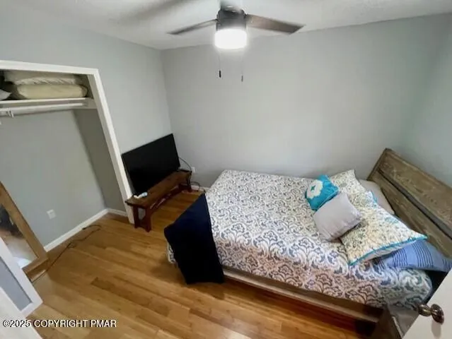 a bedroom with a bed and flat screen tv