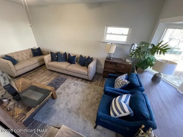 a living room with furniture and a rug