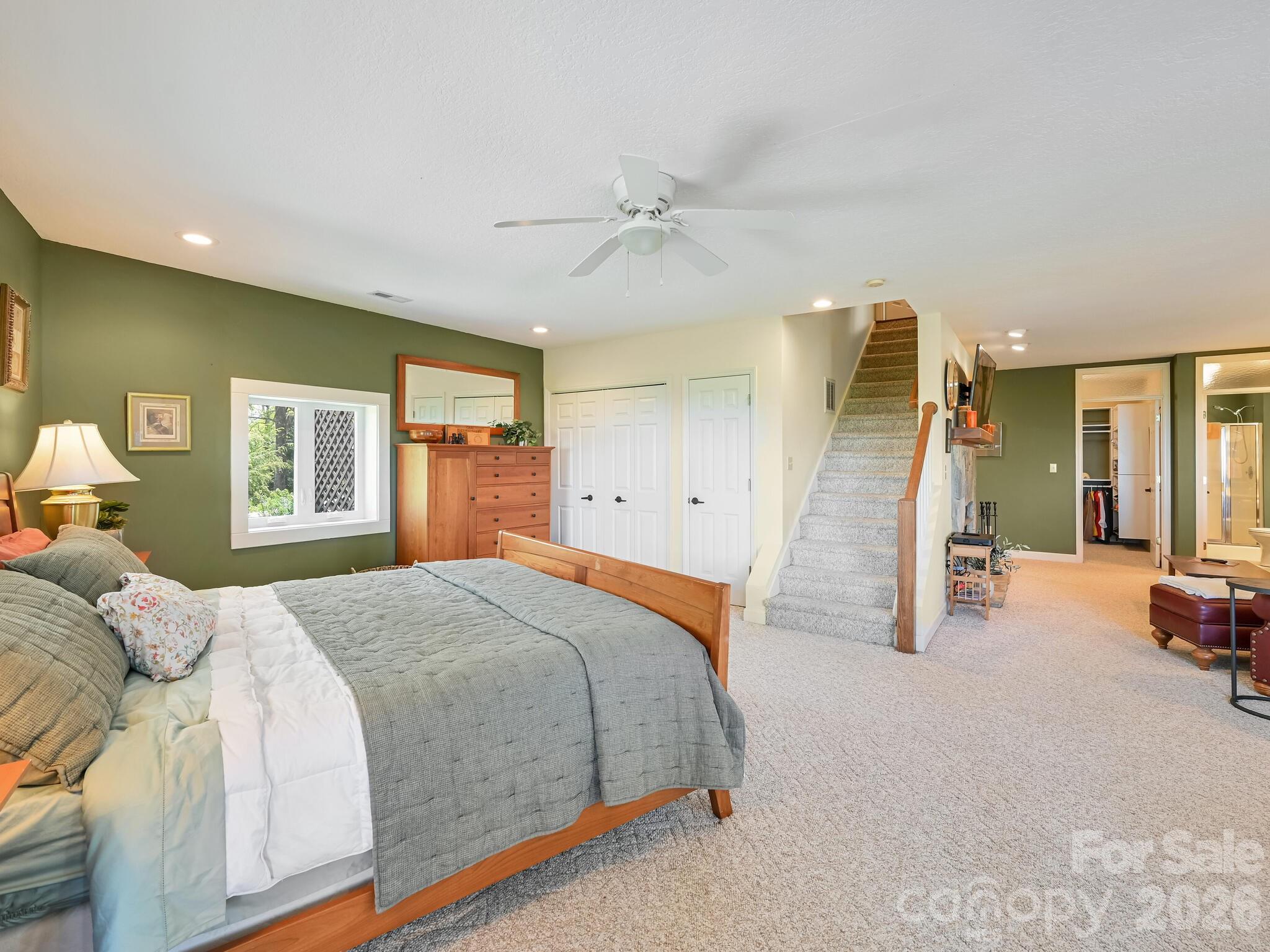 107 Fawns Rest Black Mountain, NC 28711 - Photo 25 of 47 a spacious bedroom with a bed and a large window