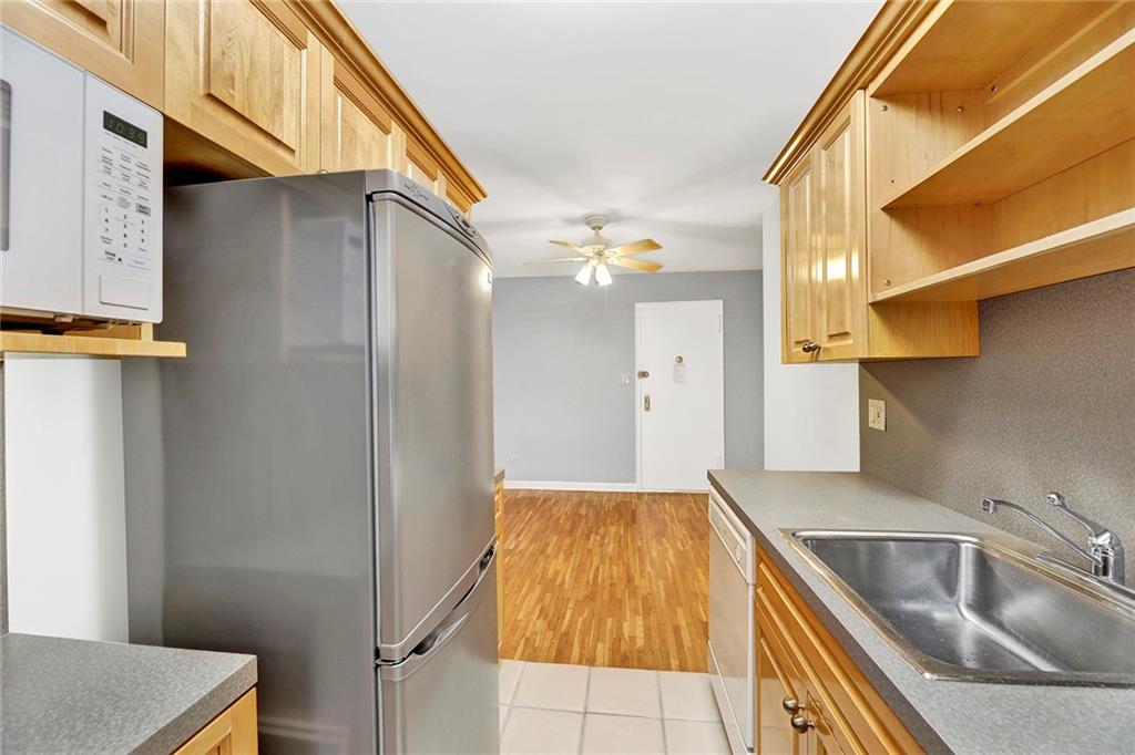 9411 Shore Road, Unit 1I Brooklyn, NY 11209 - Photo 12 of 13 a kitchen with a sink and refrigerator