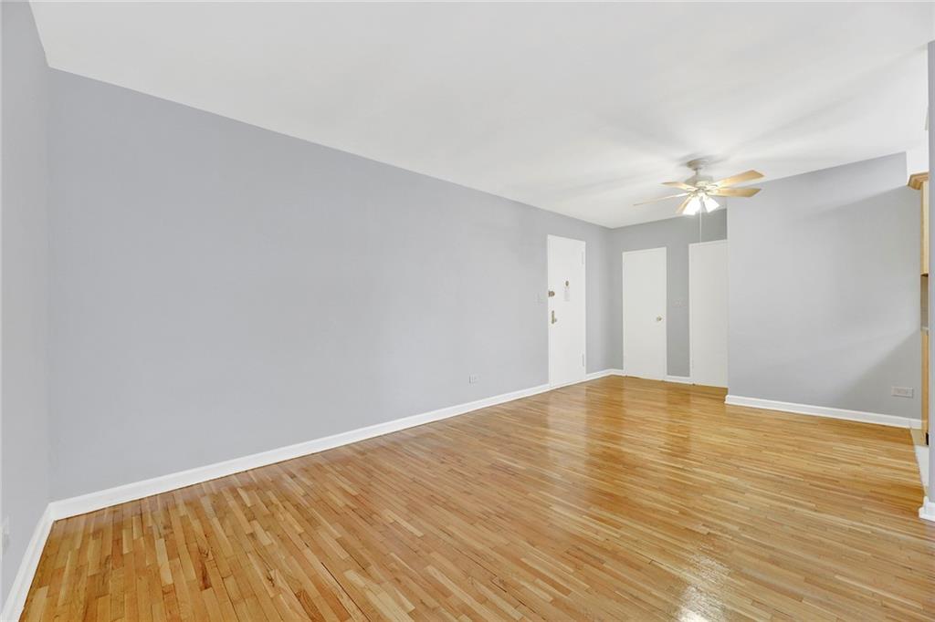 9411 Shore Road, Unit 1I Brooklyn, NY 11209 - Photo 6 of 13 a view of an empty room with wooden floor