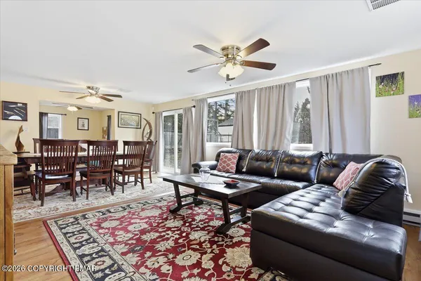 a living room with furniture and a rug