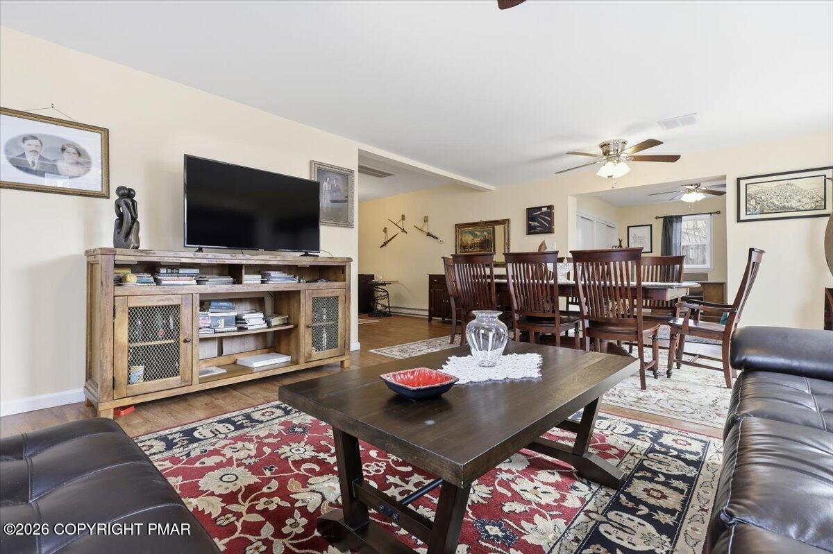 208 Shine Hill Road Henryville, PA 18332 - Photo 14 of 38 a living room with furniture and a flat screen tv