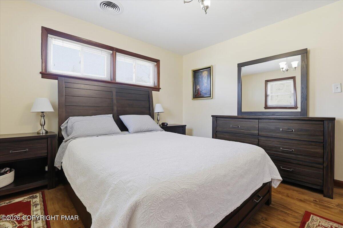 208 Shine Hill Road Henryville, PA 18332 - Photo 19 of 38 a bedroom with a bed and a dresser
