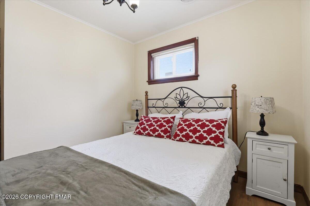208 Shine Hill Road Henryville, PA 18332 - Photo 21 of 38 a bedroom with a bed and a dresser