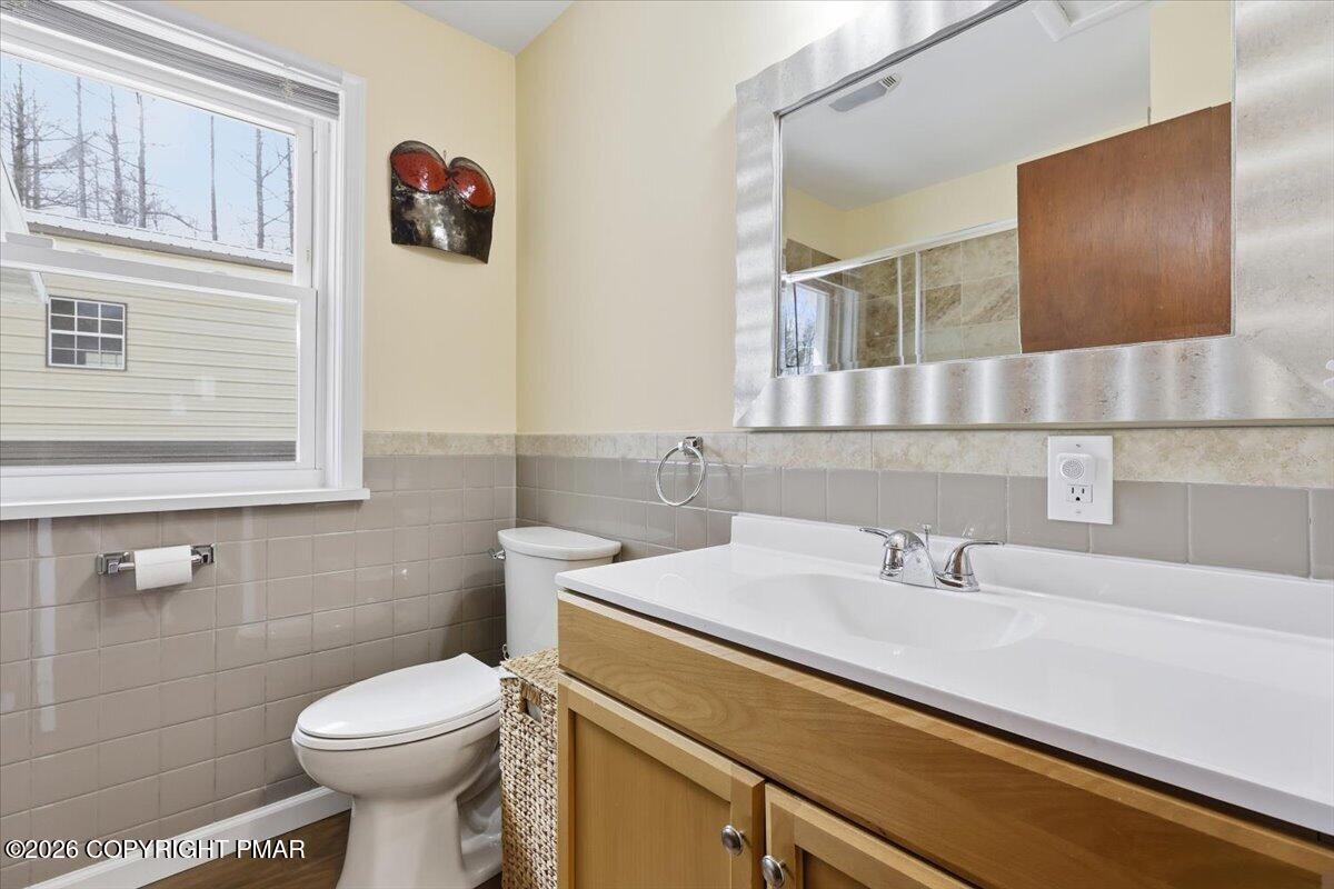 208 Shine Hill Road Henryville, PA 18332 - Photo 25 of 38 a bathroom with a sink and a toilet