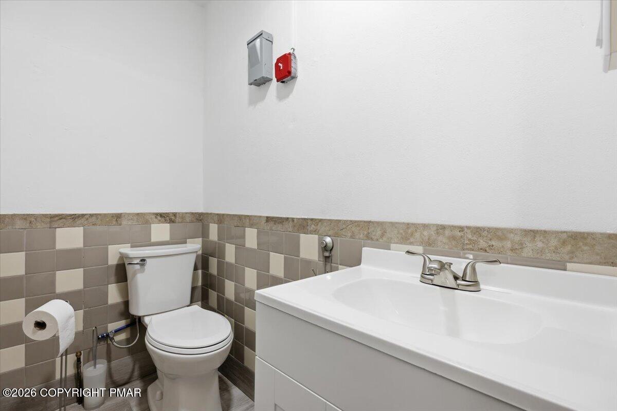 208 Shine Hill Road Henryville, PA 18332 - Photo 26 of 38 a bathroom with a sink and a toilet