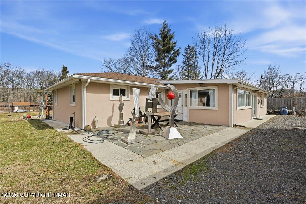 208 Shine Hill Road Henryville, PA 18332 - Photo 4 of 38 a view of a white house with swimming pool in front of it