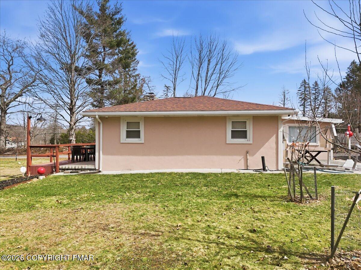 208 Shine Hill Road Henryville, PA 18332 - Photo 8 of 38 a backyard of a house with table and chairs