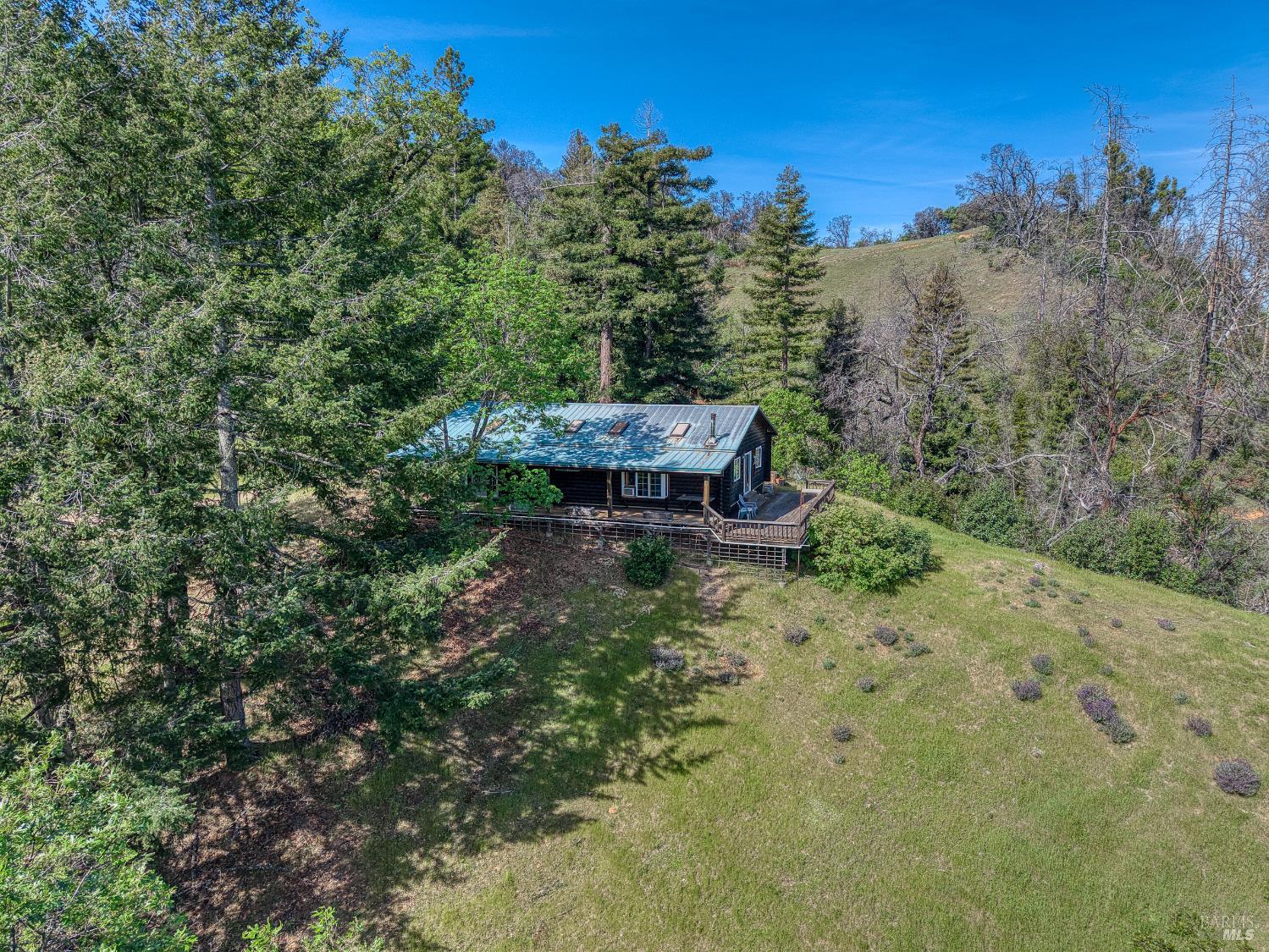 12300 Skaggs Springs Road Geyserville, CA 95441 - Photo 13 of 68 Sun and shade on a knoll. 2 big wraparound decks. French Doors to Living Room and Master Bedroom.