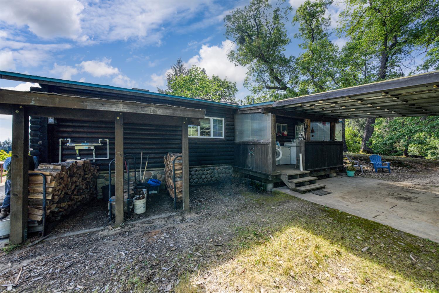 12300 Skaggs Springs Road Geyserville, CA 95441 - Photo 16 of 68 Fire wood storage, carport & laundry deck.