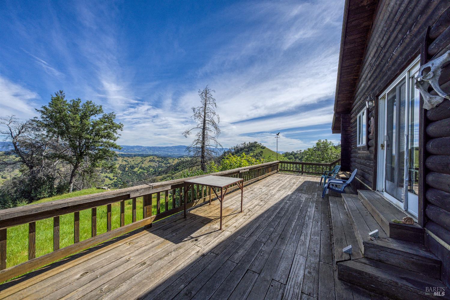 12300 Skaggs Springs Road Geyserville, CA 95441 - Photo 18 of 68 a view of balcony with couch and wooden floor