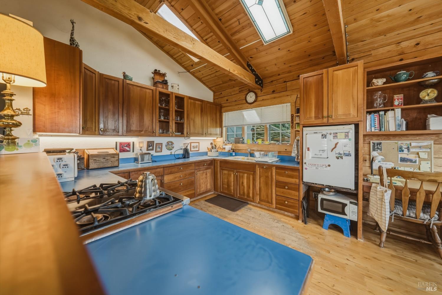 12300 Skaggs Springs Road Geyserville, CA 95441 - Photo 30 of 68 a kitchen with stainless steel appliances granite countertop a stove refrigerator and cabinets