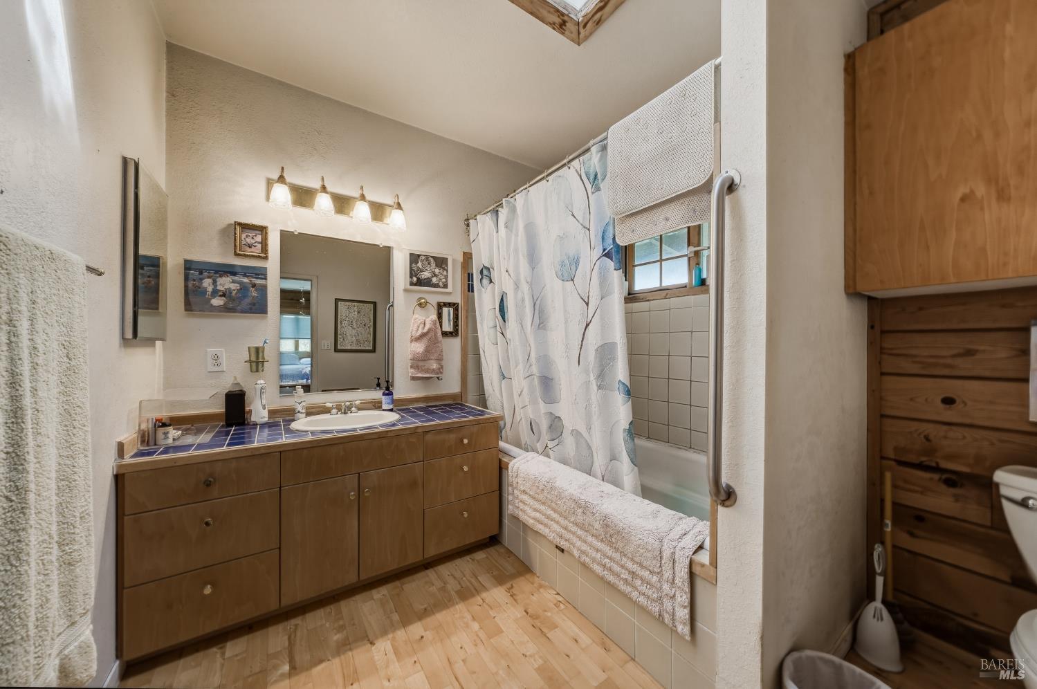 12300 Skaggs Springs Road Geyserville, CA 95441 - Photo 35 of 68 a bathroom with a double vanity sink a mirror and a shower