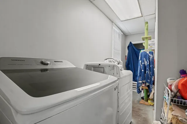 a bed room with a bed and a chair