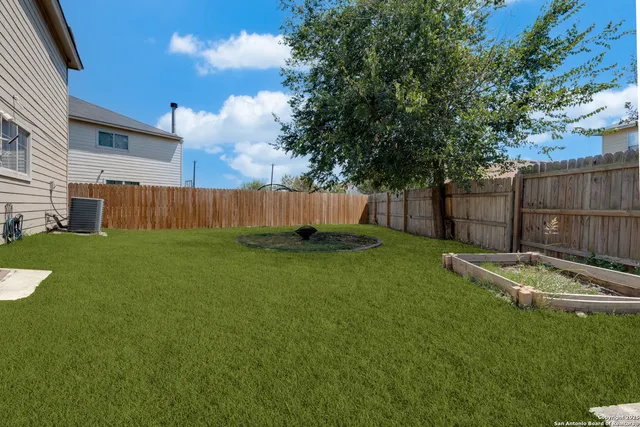 a view of a backyard with a garden
