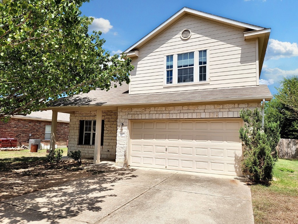 710 Rancho Viejo Lane Leander, TX 78641 - Photo 1 of 1 a front view of a house with a yard and garage
