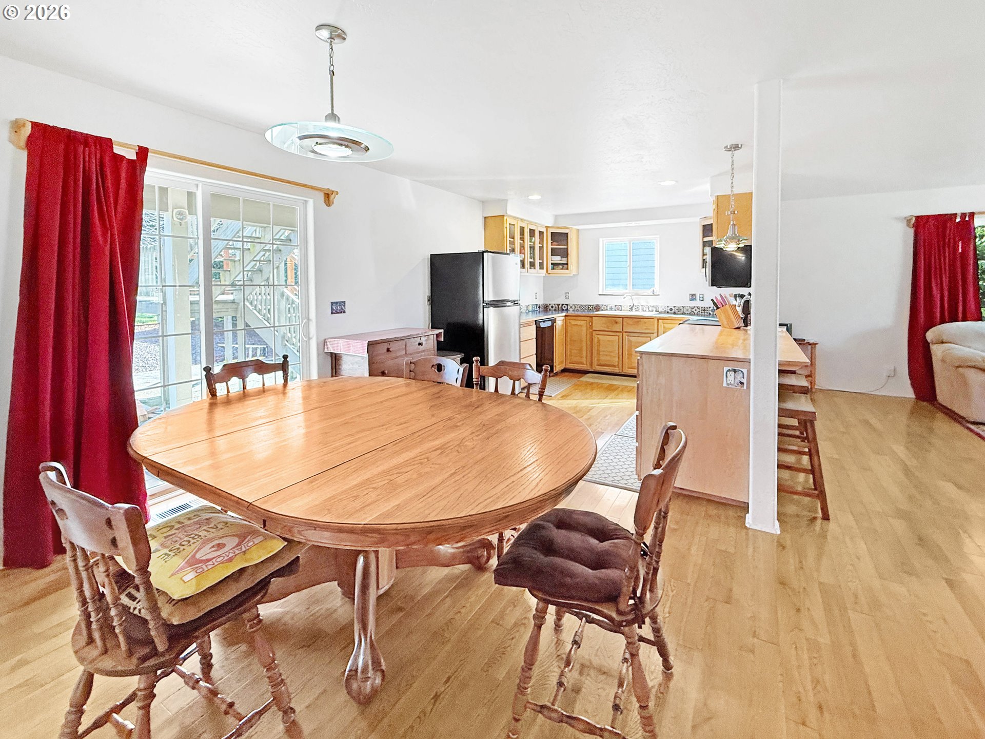 17197 Passley Road Brookings, OR 97415 - Photo 14 of 46 a dining room with furniture and wooden floor