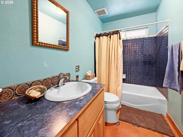 a bathroom with a sink a toilet and a bathtub