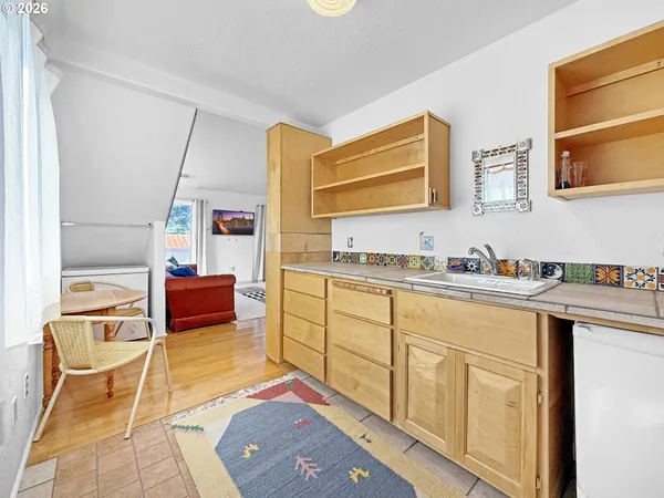 a spacious bathroom with a sink and a mirror
