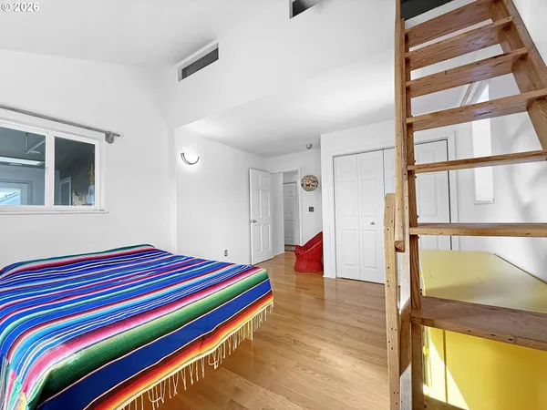 a room with a bed and a window