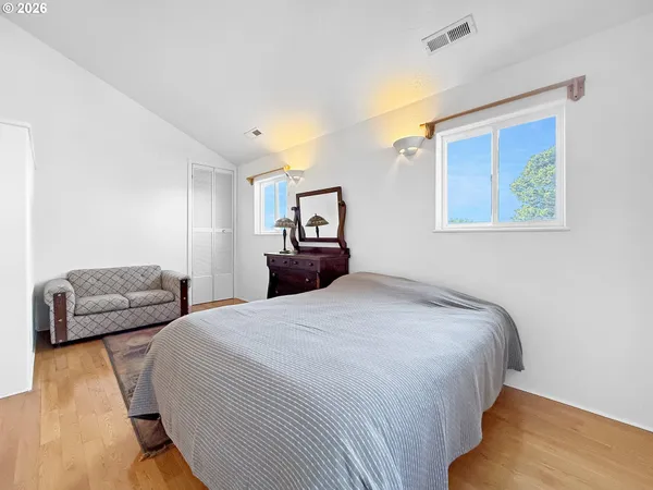 a bedroom with bed and furniture