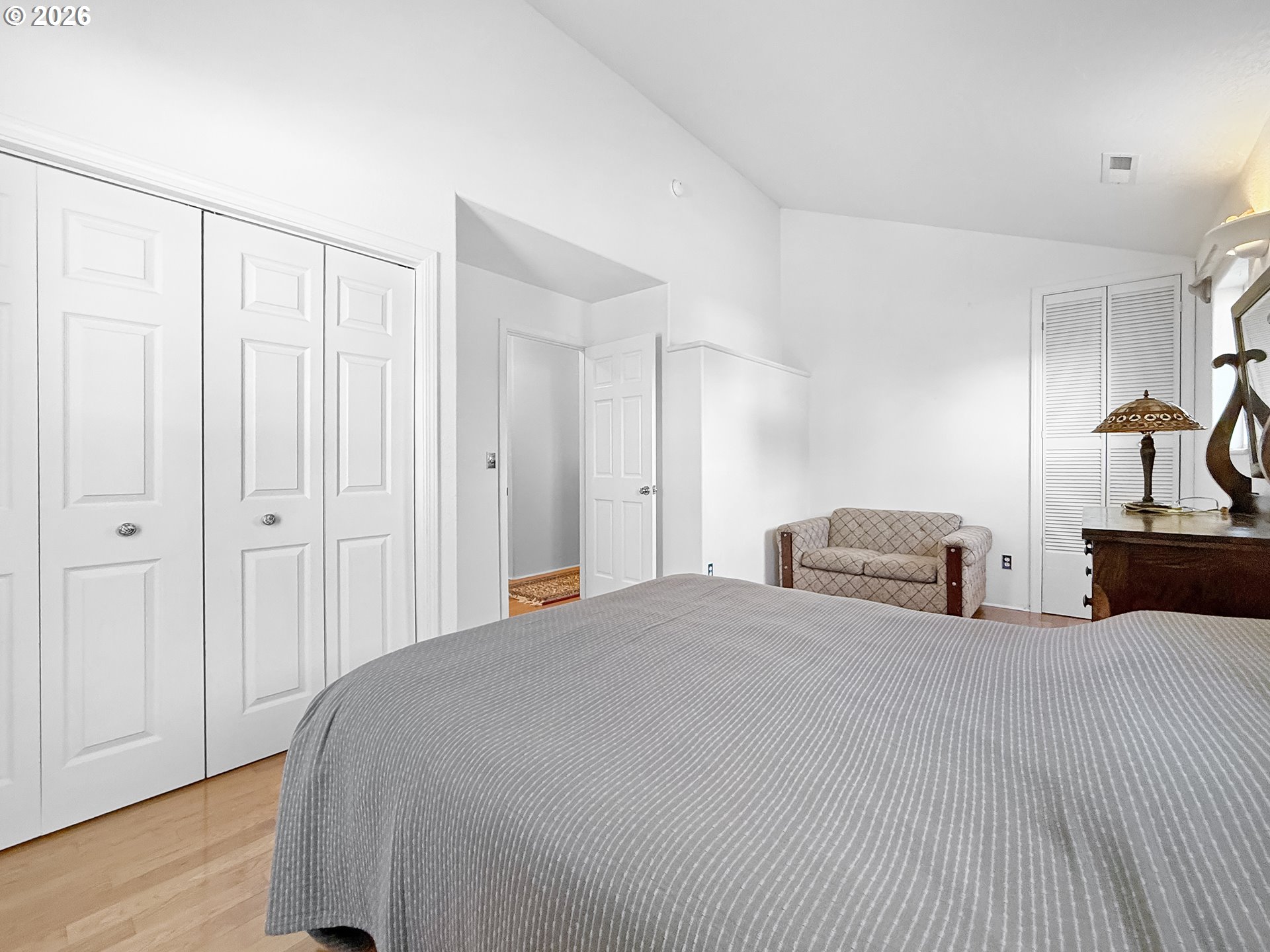 17197 Passley Road Brookings, OR 97415 - Photo 36 of 46 a spacious bedroom with a bed and a closet