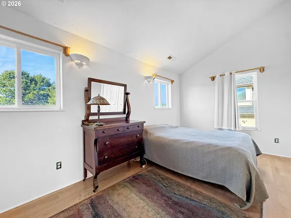 a bedroom with a bed and window