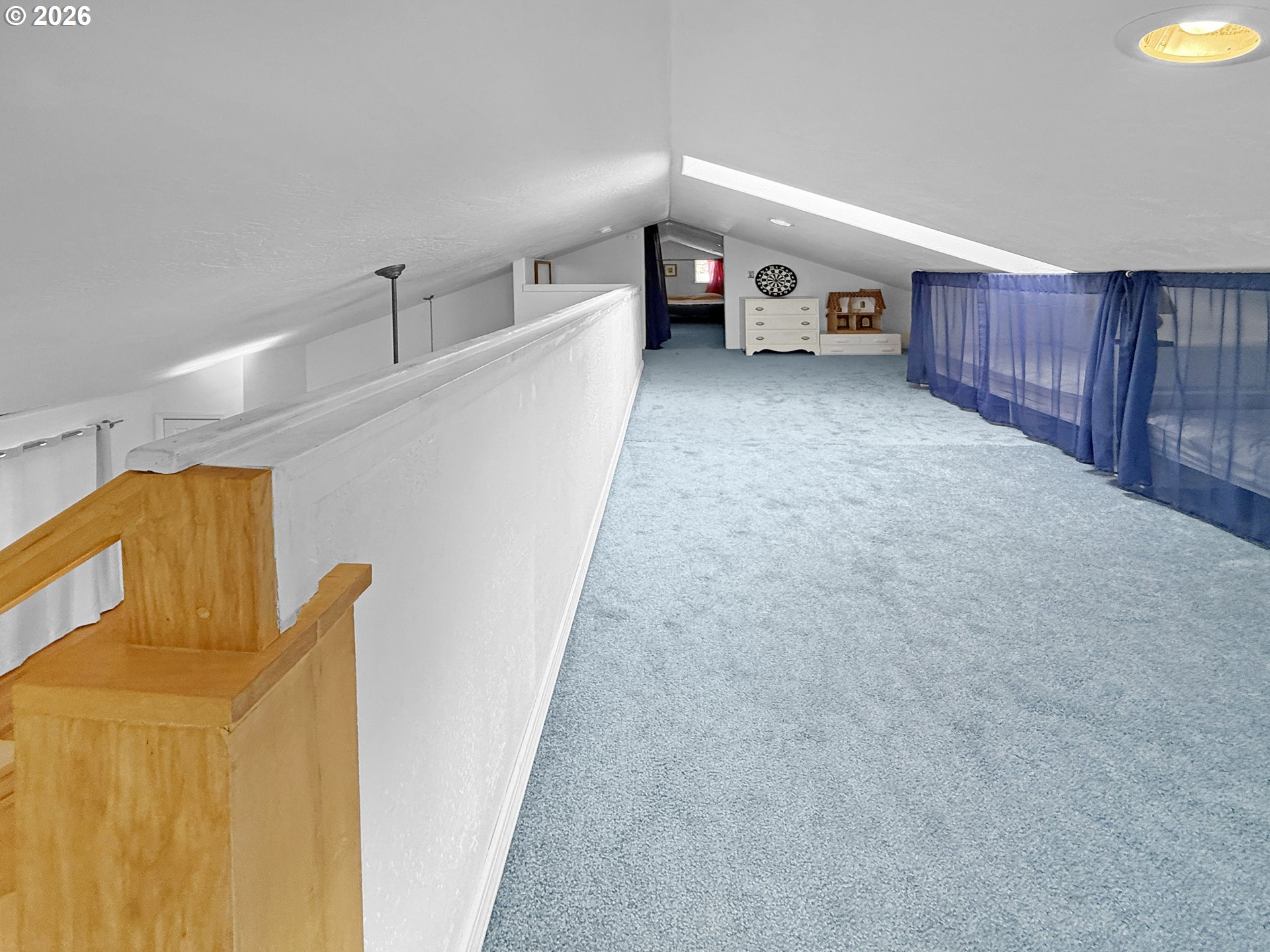 17197 Passley Road Brookings, OR 97415 - Photo 40 of 46 a big room with wooden floor and furniture