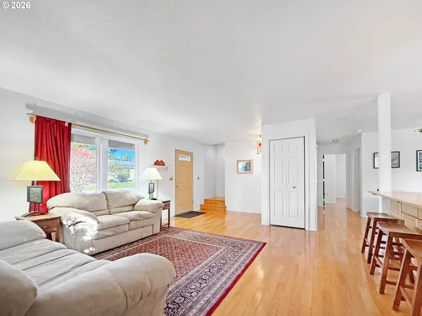 a living room with furniture and a rug