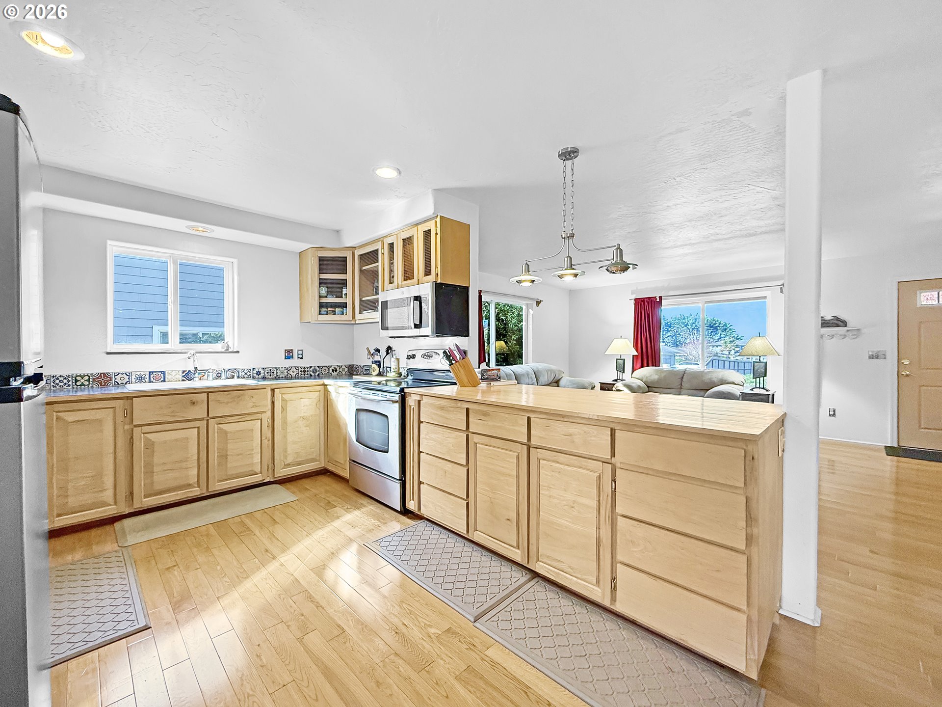 17197 Passley Road Brookings, OR 97415 - Photo 10 of 46 a kitchen with cabinets oven and a sink