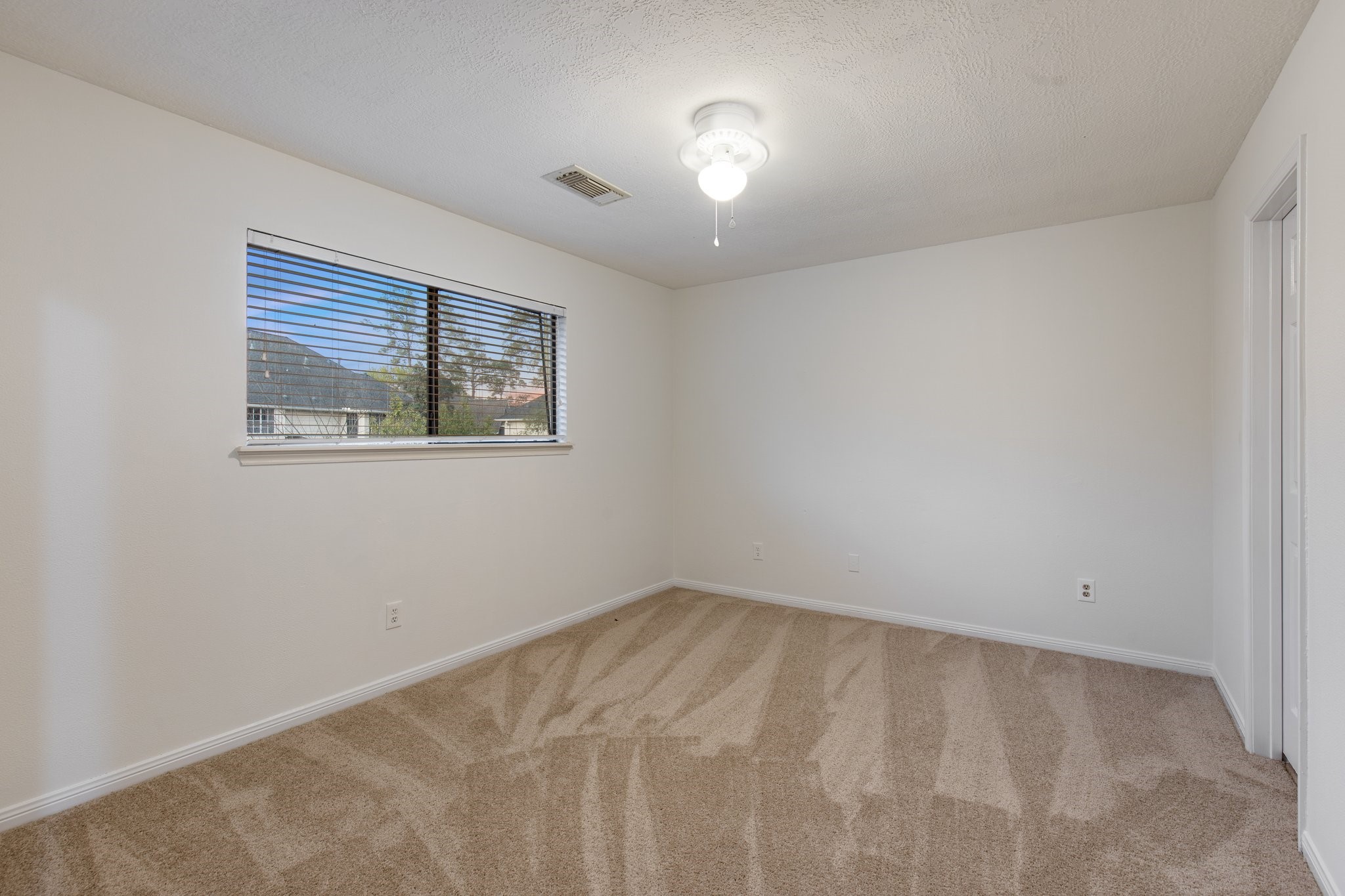 17902 Fernbluff Drive Spring, TX 77379 - Photo 21 of 38 an empty room with a window
