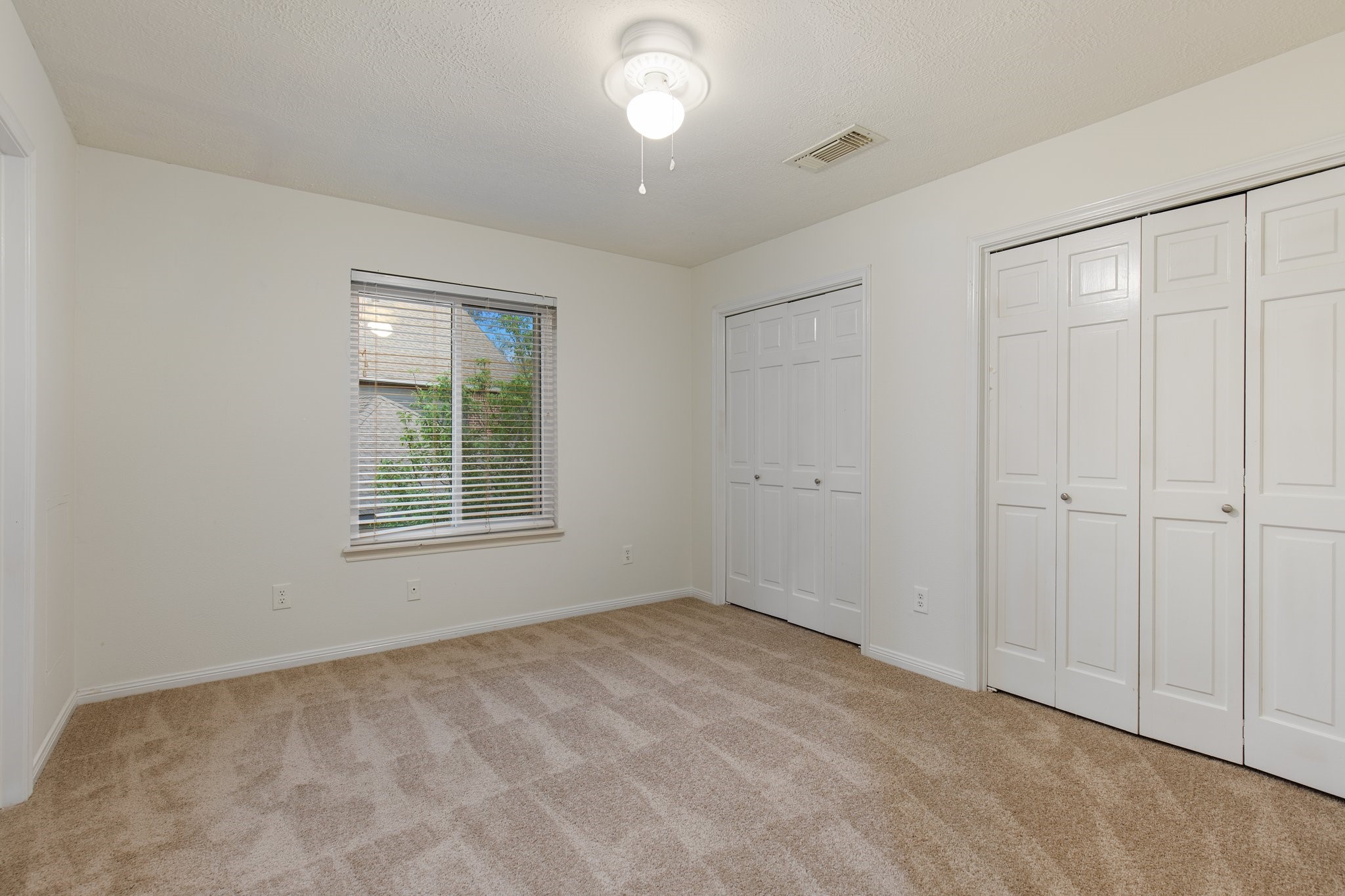 17902 Fernbluff Drive Spring, TX 77379 - Photo 24 of 38 a view of an empty room with a window