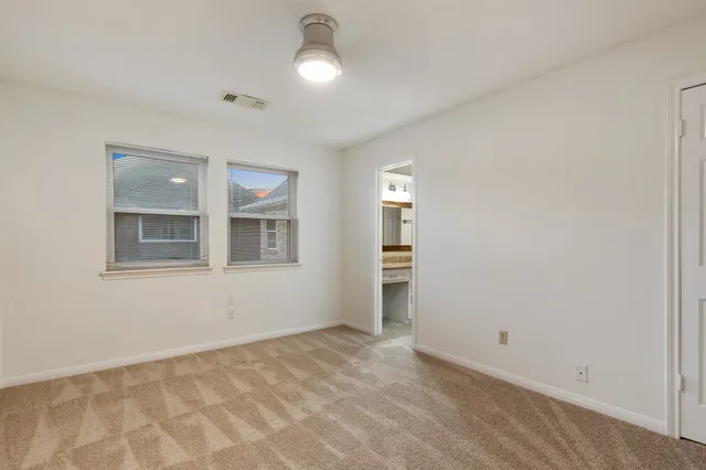 a view of empty room with windows