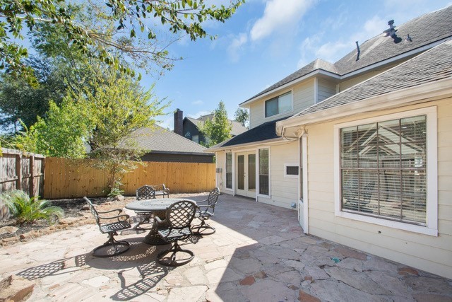 17902 Fernbluff Drive Spring, TX 77379 - Photo 32 of 38 a view of a patio with table and chairs and potted plants