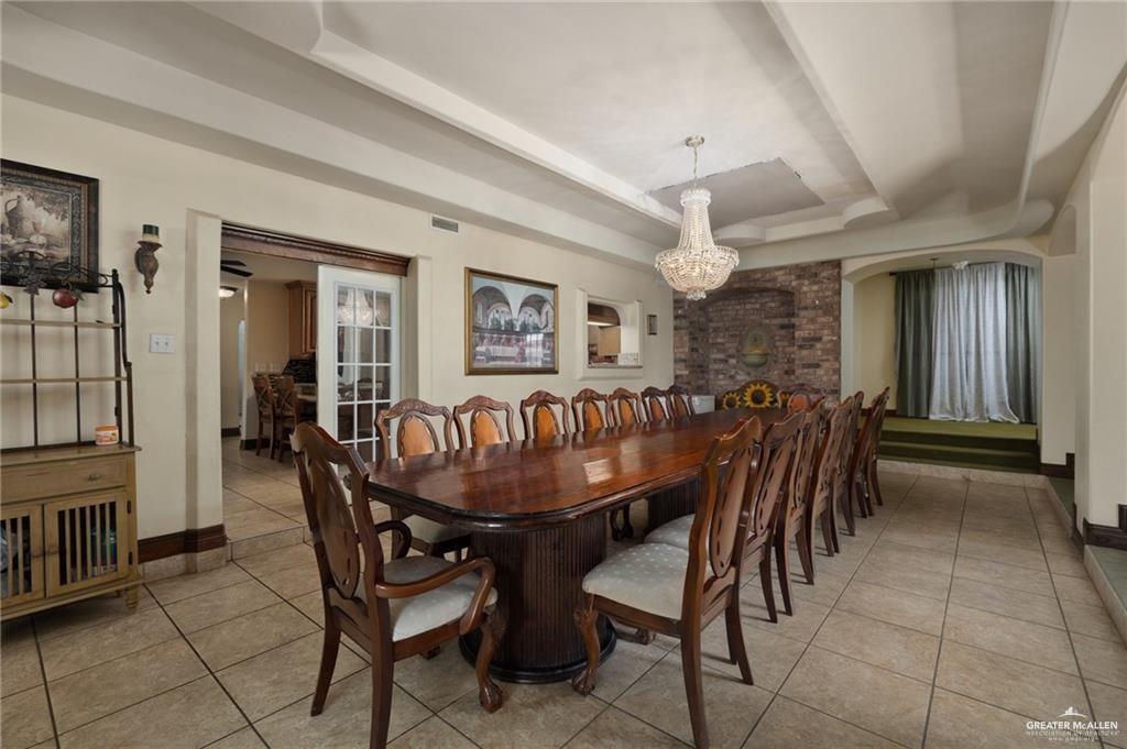 4523 South Tower Road Edinburg, TX 78542 - Photo 15 of 34 a dining room with furniture and window